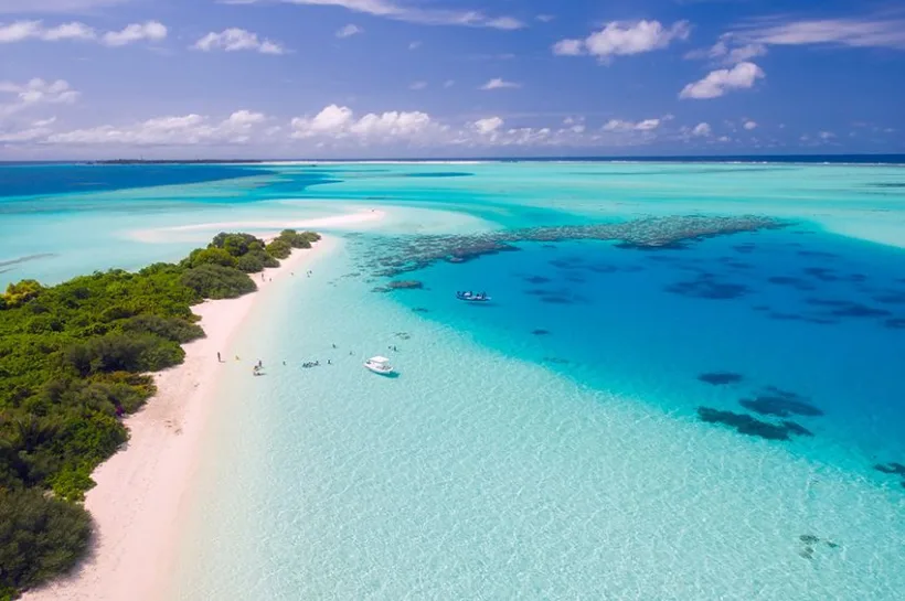 Copie a Copie a Early tourists choices to the sea of Maldives in fancy dresses and suits